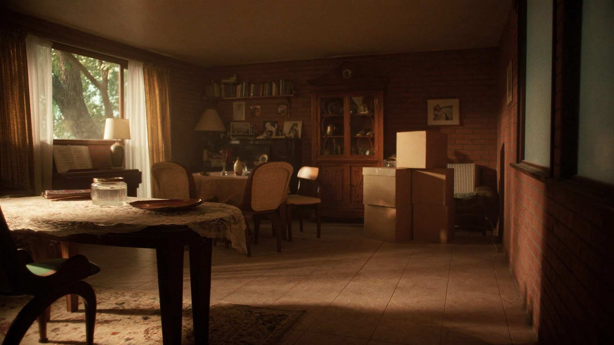 Dining room of an older bungalow with a china cabinet and packed boxes
