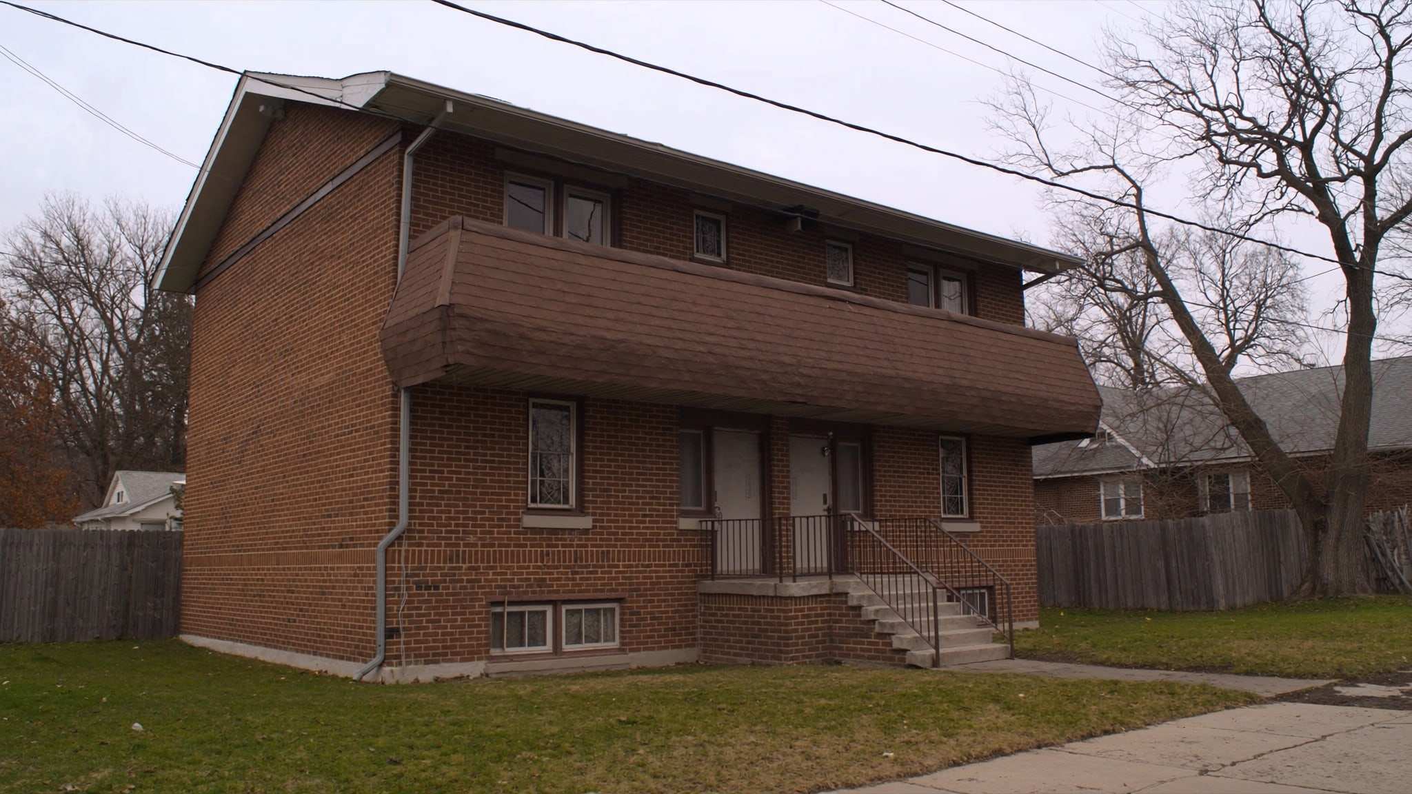 Brick two-flat building with stacked porches